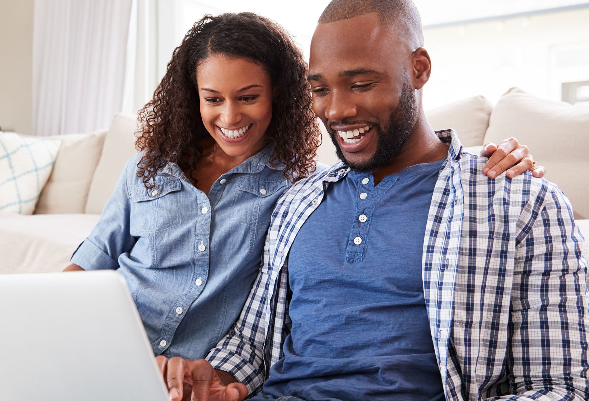 happy couple on computer, happy couple applying for a mortgage online, get a free quote today, get a mortgage quote, couple getting a non-qm loan, couple applying for a self-employment loan, couple getting a non-qm purchase home loan, non-qualified mortgage application