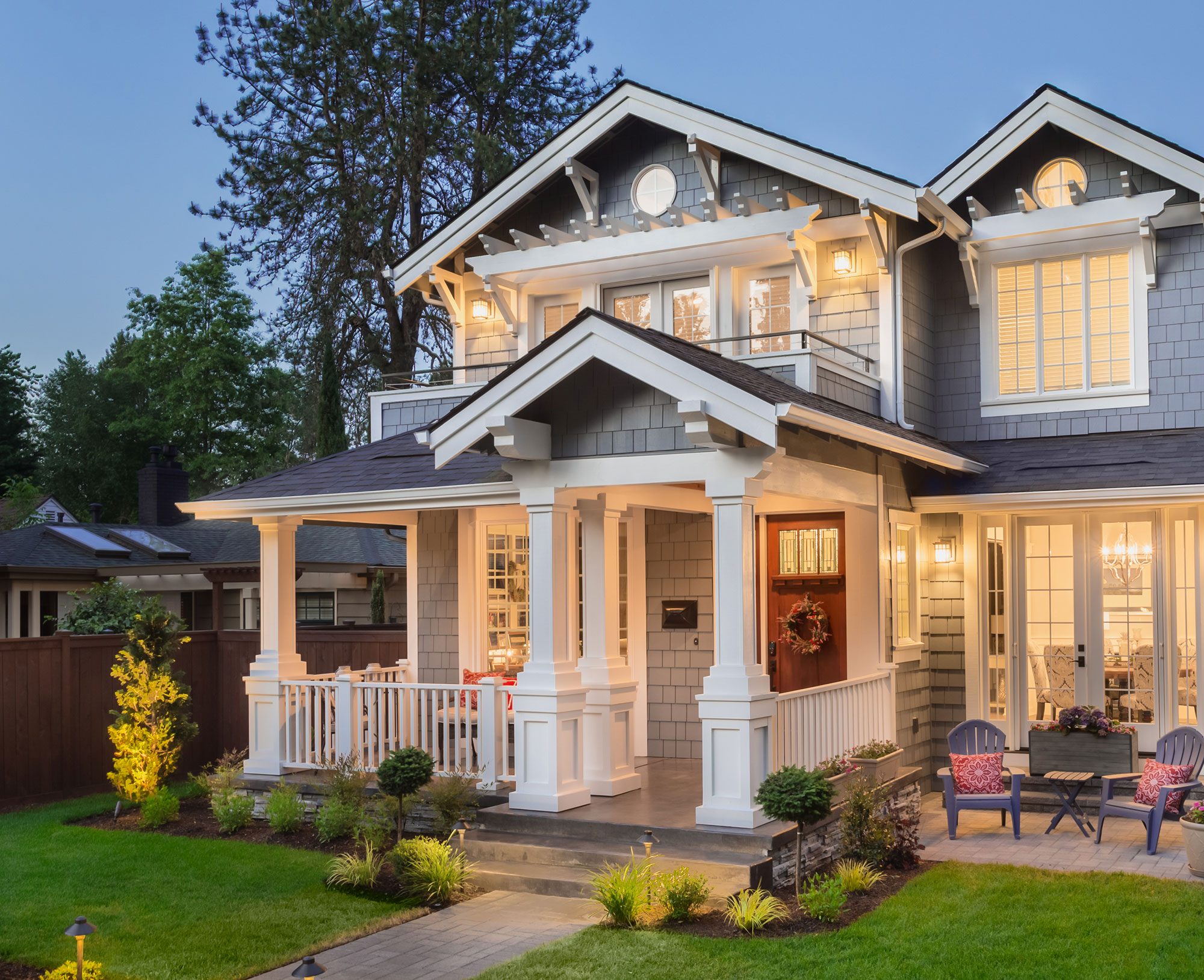 house, housing refinance, cash out refinnace, grey home facade with lights on and grass out front